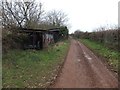 SX9699 : Killerton Park cycle path (6) passing farm shed by David Smith