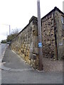 NU1034 : Road side wall, Belford by Maigheach-gheal