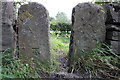 Benchmarked stone stile beside A684