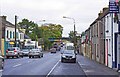 M4501 : Looking northwest along Georges Street to the railway bridge, Gort by P L Chadwick
