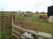 SO5018 : Old tractors in a field at the edge of Welsh Newton by Jaggery