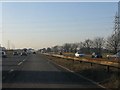 Power lines cross the westbound M62