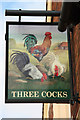 The sign of the Three Cocks