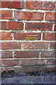 Benchmark on electricity substation wall, Dragon Lane