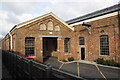 SP8141 : Former railway works building used as carpark by Roger Templeman