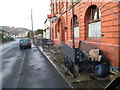 Two former mining trucks in front of the Crown Hotel, Ynyswen