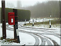 SO8854 : Postbox and snowy lane - Swinesherd by Chris Allen