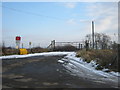 Road to level crossing giving access to West Brocks and White House farmsteads