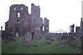 NU1241 : Lindisfarne Priory, with a distant view of the Castle by Christopher Hilton