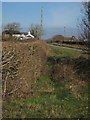 Cottage and road near Goodacre