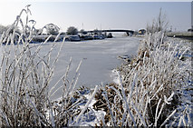 TL2398 : Millennium Bridge and frozen river Nene by Julian Dowse