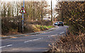 Traffic lights control a narrow stretch of road