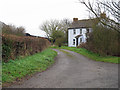 Footpath on farm track past cottage