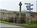 SE7565 : War memorial and signpost, Westow by Christine Johnstone