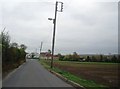 Leaning poles on Cooling Rd