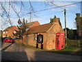 Former smithy and telephone kiosk