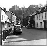 SS9943 : The High Street and Castle, Dunster, 1940 by Frances Bertha Reynolds
