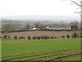 View across farmland to a cottage on Loughorne Road