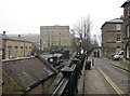 SE1338 : Saltaire: station and Salt's Mill by John Sutton