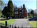 Large house tucked under the railway embankment