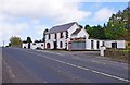 R6981 : The R463 road, Mickey Rooney's Bar and Fit Right Stoves at Ogonnelloe, Co. Clare by P L Chadwick