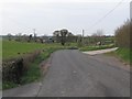 J1336 : Farm entrances on a winding Ouley Road by Eric Jones