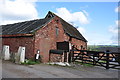 Red brick farm buildings near Upper Nobut