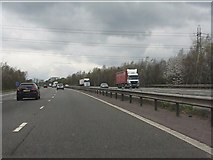 SP1869 : Power lines cross the M40 motorway by Peter Whatley