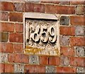 Date stone on house on Cedar Street