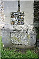 Benchmark on buttress of St Nicholas Loughton church