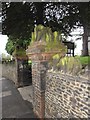 St John the Evangelist, Hale: pillar by the church gates