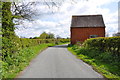 Red brick Barn and footpath on Cullamore Lane