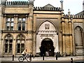 Cyclist passing Brighton Dome