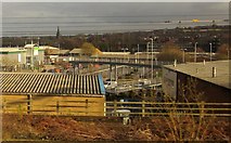 SE2832 : Footbridge, roads and buildings, Leeds by Derek Harper