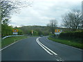 A483 at College Bridge and Derwydd village boundary sign