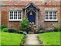 Cottage in Hollow Lane, Wotton (3): logs in the porch