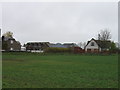 Group of houses north of airfield