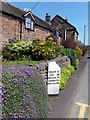 Milestone and cottages 