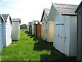 Beach huts in meadow, Old Felixstowe