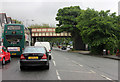 Wilmslow Road (A5145) and railway bridge