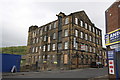 One converted factory demolished, its neighbour standing