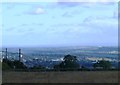 The view of Yeadon from The Chevin, with Emley Moor TV tower in the distance.