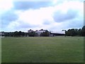 View of the Gurnell Sports Centre from the meadow behind it