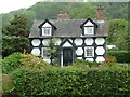 Black and white cottage near Fron, Powys