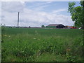 Large Farm Building and Fields Near Ringshall