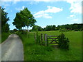 Bridleway leaves track and enters field near Pest House