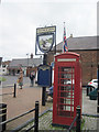 Phone box and Fleece Inn sign Burgh-le-Marsh