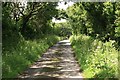 SW8758 : Cornish lane leading towards Coswarth crossing by roger geach