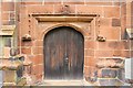 SJ4154 : The South Door of St Chad's Church, Holt by Jeff Buck