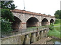 Road bridge and footbridge across the River Trym, Sea Mills, Bristol